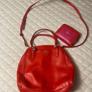 Orange coach purse plus wallet.